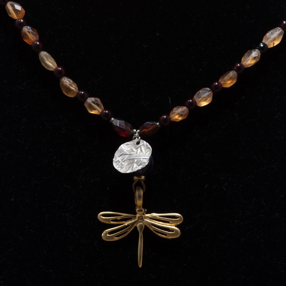 Boho butterfly copper with hammered silver disc and garnet and topaz.